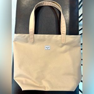 Never used, brand new Herschel tote in rose gold.